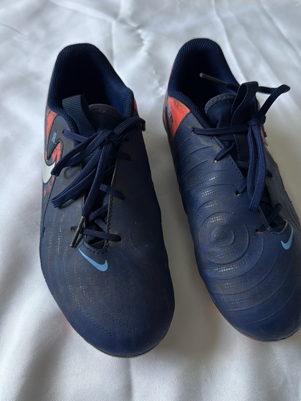 Nike Phantom Dark Blue Soccer Cleats with Light Blue and Orange Accents